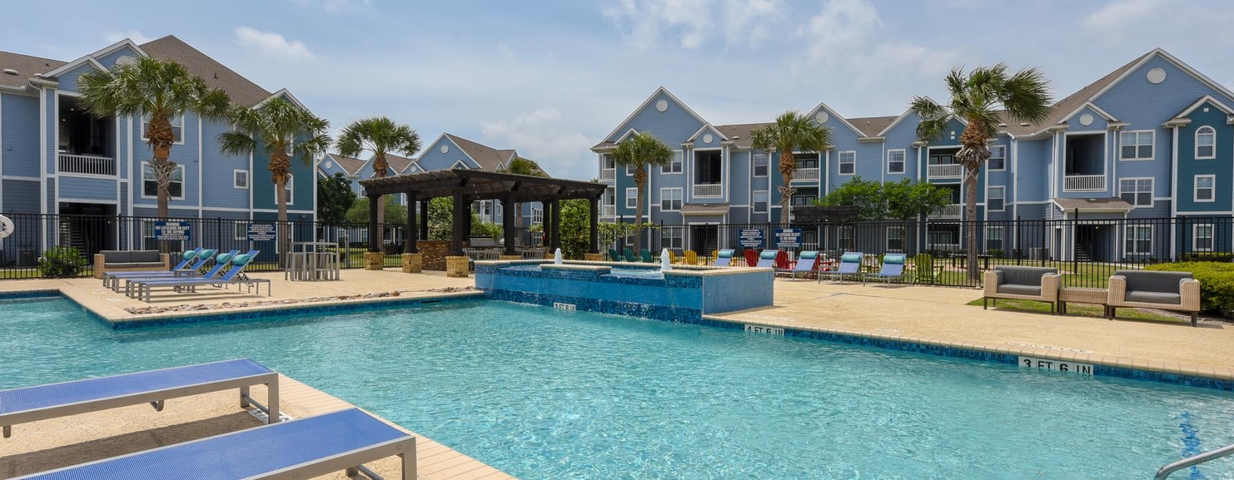a pool with a building in the background