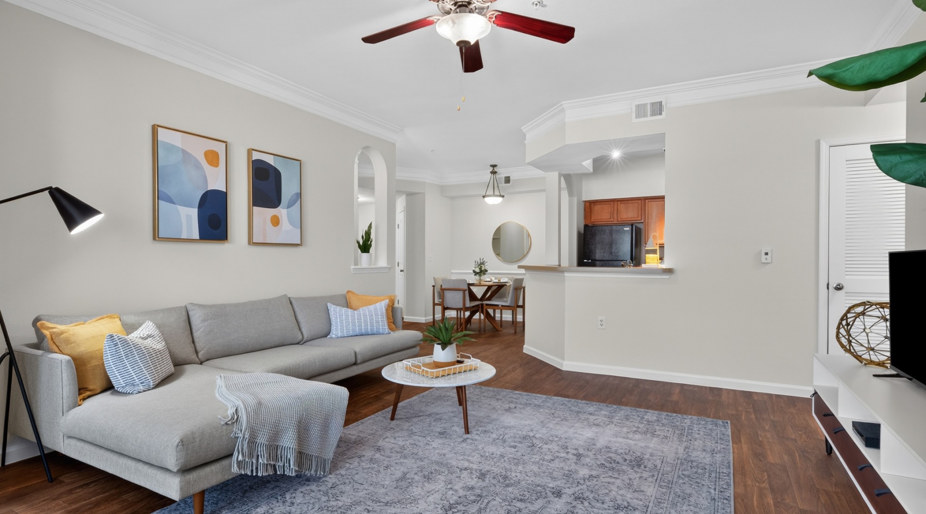 a living room with a couch and a tv