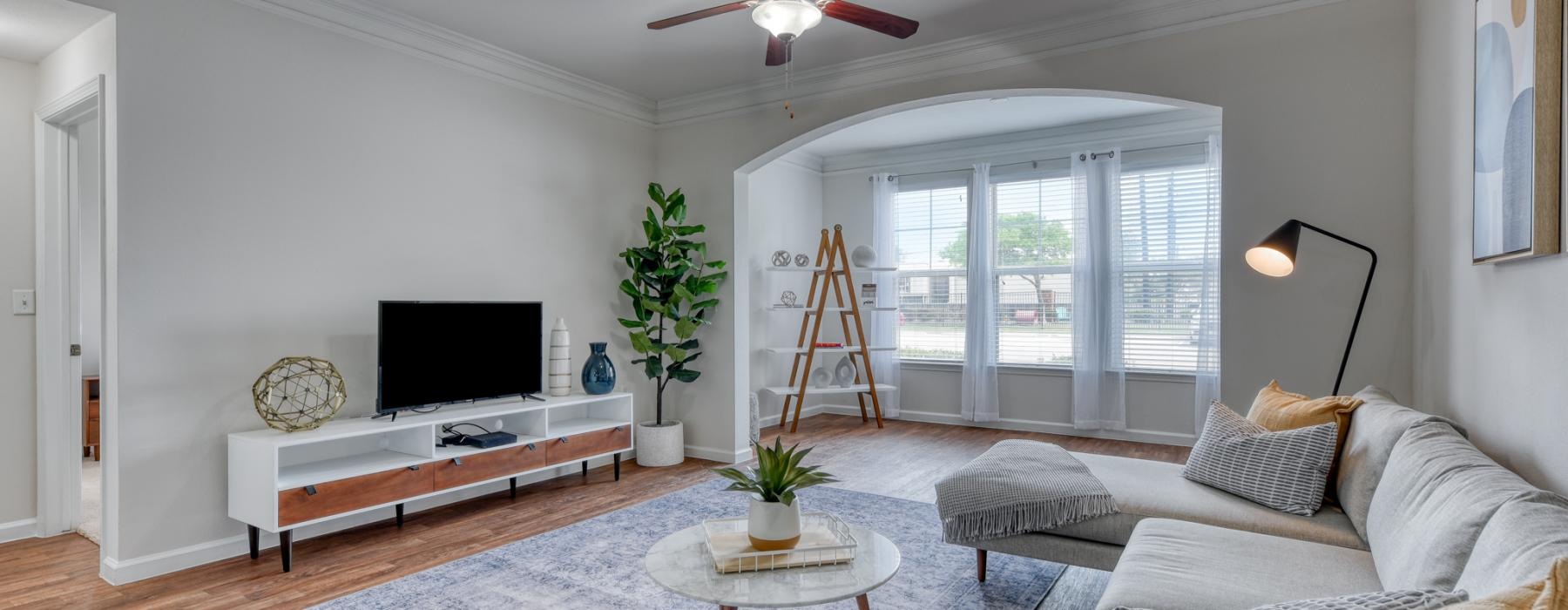 a living room with a piano and a couch